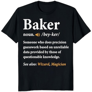 May include: Black t-shirt with the definition of "Baker" in white text. The definition includes the pronunciation, a humorous description, and cross-references to "Wizard" and "Magician".