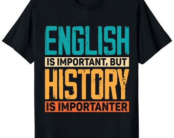 May include: Black t-shirt with the text "ENGLISH IS IMPORTANT, BUT HISTORY IS IMPORTER". The text is in teal, orange, and white. The shirt is a crew neck and has short sleeves.