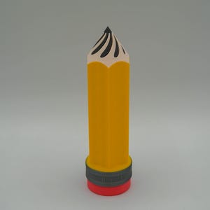 May include: A yellow pencil-shaped object with a black tip and a red base. The pencil has a gray band between the yellow body and the red base. The pencil tip has black curved lines.