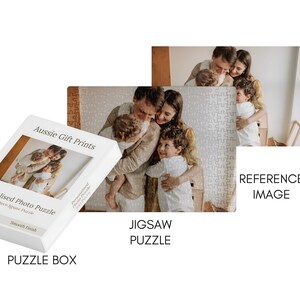 May include: A white puzzle box with the text "Aussie Gift Prints" and "Personalised Photo Puzzle". The box features a family photo. A completed jigsaw puzzle and a reference image of the family are also shown.