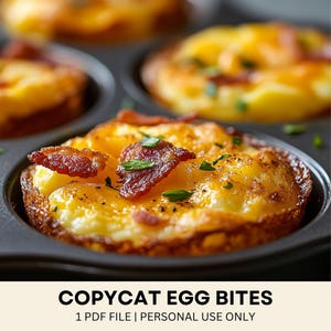 May include: Close-up of baked egg bites with crispy bacon and green herbs in a muffin tin. The egg bites have a golden-brown crust and a fluffy, yellow interior. The text "COPYCAT EGG BITES" is at the bottom.