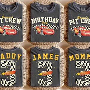 May include: Six gray t-shirts with various designs. The top row features Lightning McQueen from the movie Cars, with text that reads "James's Pit Crew" and "Birthday Boy". The bottom row has "Daddy", "James", and "Mommy" with a number 3 and the number 95.