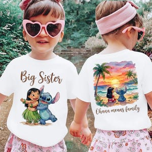 May include: White t-shirts featuring Lilo and Stitch graphics. One shirt says "Big Sister" and shows Lilo and Stitch. The other has a beach scene with Lilo and Stitch and the text "Ohana means family."