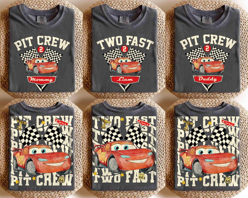 May include: A white ceramic mug with a black handle and the text "But First, Coffee" in a bold, black font. The mug is set against a blurred background. The mug appears to be approximately 10 cm tall.