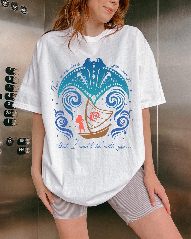 May include: White t-shirt featuring a blue and brown graphic with the text "There is nowhere you can go that I won't be with you...". The graphic includes a boat, waves, and a palm tree design.