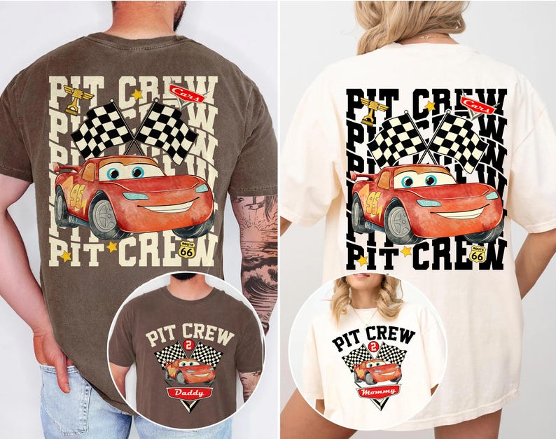 May include: Two t-shirts featuring a red cartoon race car with the text "PIT CREW". One shirt is brown and the other is cream. The design includes checkered flags, a trophy, and the number 95.