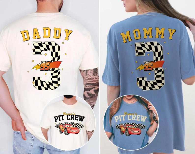 May include: Two t-shirts, one cream and one blue, featuring a racing theme. The cream shirt says "DADDY" above a large number "3" with a checkered pattern and "95" in orange. The blue shirt says "MOMMY" with the same design.