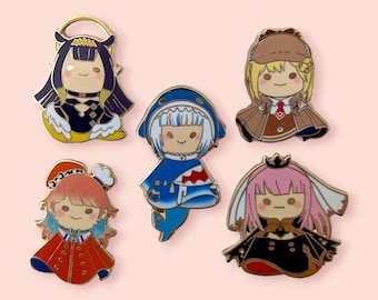 May include: Five enamel pins featuring cartoon characters. The characters are a girl with black hair and a halo, a girl with blonde hair wearing a detective hat, a girl with pink hair wearing a crown, a girl with pink hair wearing a blue shark costume, and a girl with red hair wearing a red coat.