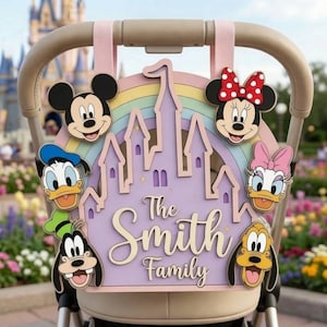 May include: A decorative wooden sign featuring a pastel rainbow and a light purple castle silhouette. The sign displays the text "The Smith Family" and includes cutouts of Mickey Mouse, Minnie Mouse, Donald Duck, Daisy Duck, Goofy, and Pluto.