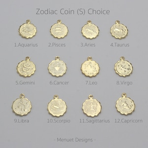 May include: Twelve gold zodiac coin charms, each featuring a different zodiac sign. The coins are arranged in four rows of three, with the zodiac sign name written below each coin. The text "Zodiac Coin (S) Choice" is at the top of the image, and the text "Menuet Designs" is at the bottom.