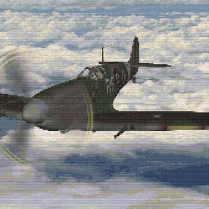May include: A vintage World War II era fighter plane, a Spitfire, soars through a cloudy sky. The aircraft is painted in camouflage colors, with a spinning propeller and detailed markings on the fuselage and wings.