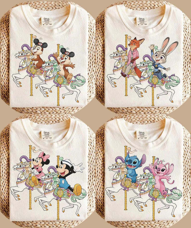 May include: Four cream-colored t-shirts with cartoon carousel designs. Each shirt features a different set of characters riding a carousel horse. The characters include Chip and Dale, Nick Wilde and Judy Hopps, Mickey and Minnie Mouse, and Stitch and Angel.