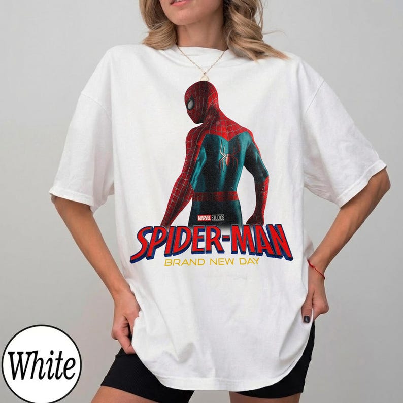 May include: A white ceramic mug with a black handle and the text "But First, Coffee" in a bold, black font. The mug is set against a blurred background, highlighting its clean design.