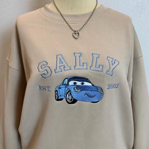 Sally Embroidered Sweatshirt, Disney Cars Pixar Pullover, Beige Unisex Varsity Crewneck, Gift for Her, Cartoon Car Sweater - ESN804.H