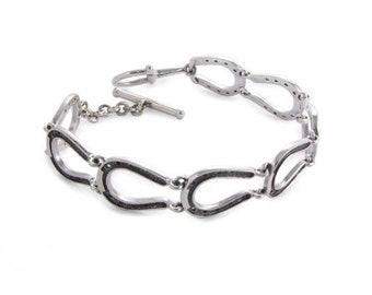 Sterlingzilveren hoefijzerarmband: sieraden met knevelsluiting voor ruiters