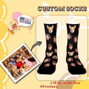 May include: Black custom socks with multiple faces and dog faces printed on them. The socks are displayed on a yellow background with the text "CUSTOM SOCKS". The image also includes a photo of a family with their dogs and the text "MADE IN USA".