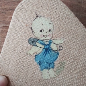 Antique Hand Painted Kewpie Baby Doll with Big Safety Pin on Beige Ecru Linen Rounded Triangle Ornament Late 1800&#39;s Early 1900&#39;s Home Decor
