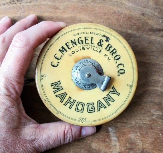 Antique Tape Measure C.C. Mengels & Bro. Co Louisville KY Mahogany Mills  Vintage Measuring Tape Reel Hand Crank Tool Advertising Promotional 