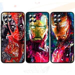 May include: Three phone cases with colorful abstract art featuring Deadpool and Iron Man. The cases are black with a raised camera bump.