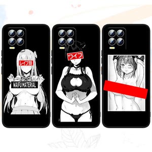 May include: Three black phone cases with different designs. The first case features a black and white illustration of a woman with the text "WAIFU MATERIAL" and "レイフ" in red. The second case features a black and white illustration of a woman with the text "ワフ" in red. The third case features a black and white illustration of a woman with a red censor bar over her chest.