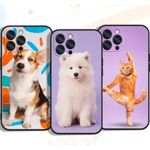 May include: Three phone cases with animal designs. One case features a corgi dog with a white, brown, and black coat against a blue and orange background. Another case has a white Samoyed puppy on a purple background. The third case shows an orange cat doing yoga.