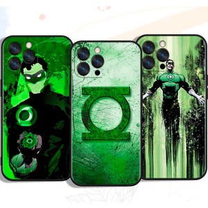 May include: Three green phone cases featuring Green Lantern designs. The cases display images of the Green Lantern symbol and illustrations of the character in action. The cases have a black border and are designed for a smartphone.