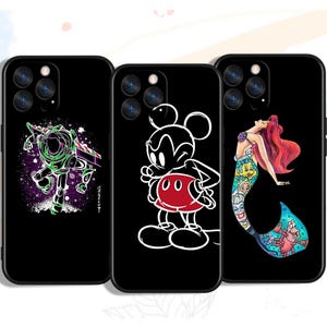 May include: Three black phone cases with different character designs. The first case features a green and blue character from the movie Toy Story. The second case features a black and white Mickey Mouse character. The third case features a mermaid character from the movie The Little Mermaid.