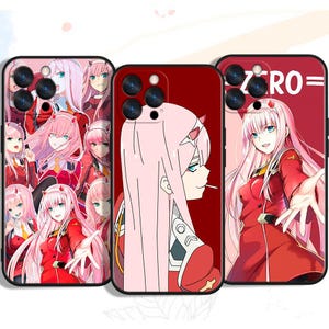 May include: Three phone cases with anime-style illustrations of a female character with pink hair and red outfits. The cases have a black border and a red background. One case has the word "ZERO=" printed on it.