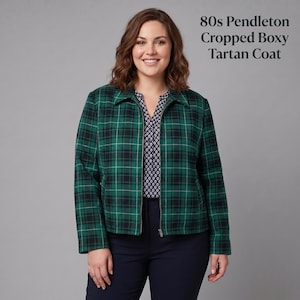 May include: A cropped boxy tartan coat in green and black with a collared neckline and a front zip fastening. The text 80s Pendleton Cropped Boxy Tartan Coat is visible in the upper right corner. The coat is worn over a dark patterned blouse.