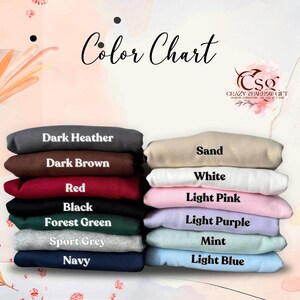 May include: A colour chart showing fabric colours such as Dark Heather, Dark Brown, Red, Black, Forest Green, Sport Grey, Navy, Sand, White, Light Pink, Light Purple, Mint, and Light Blue. The text "Color Chart" is at the top.
