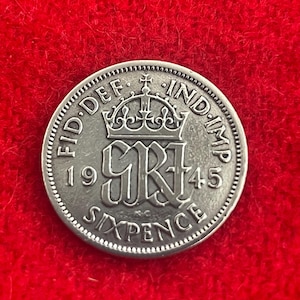 King George VI sterling silver 0.500 six pence coin from 1945