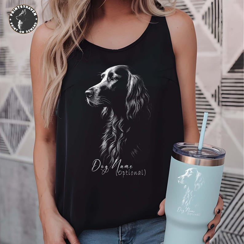 May include: Black tank top with a detailed white illustration of a dog's profile. The text "Dog Name (optional)" is below the dog image. A light blue tumbler with a matching dog illustration and text is also visible.