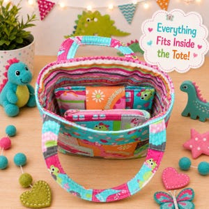 May include: A fabric tote bag with a colorful striped interior and a patchwork exterior featuring dinosaur motifs. Inside the bag are two smaller matching pouches. A white scalloped sign with pink and teal text reads Everything Fits Inside the Tote!