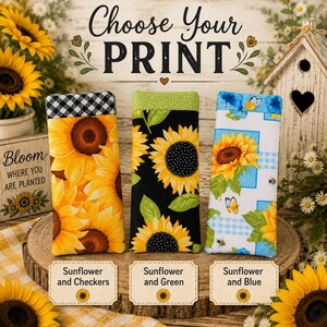 May include: Three rectangular fabric eyeglass cases featuring sunflower patterns. The left case has a black and white checkered top, the middle has a green dotted top, and the right has a blue and white checkered background with butterflies.