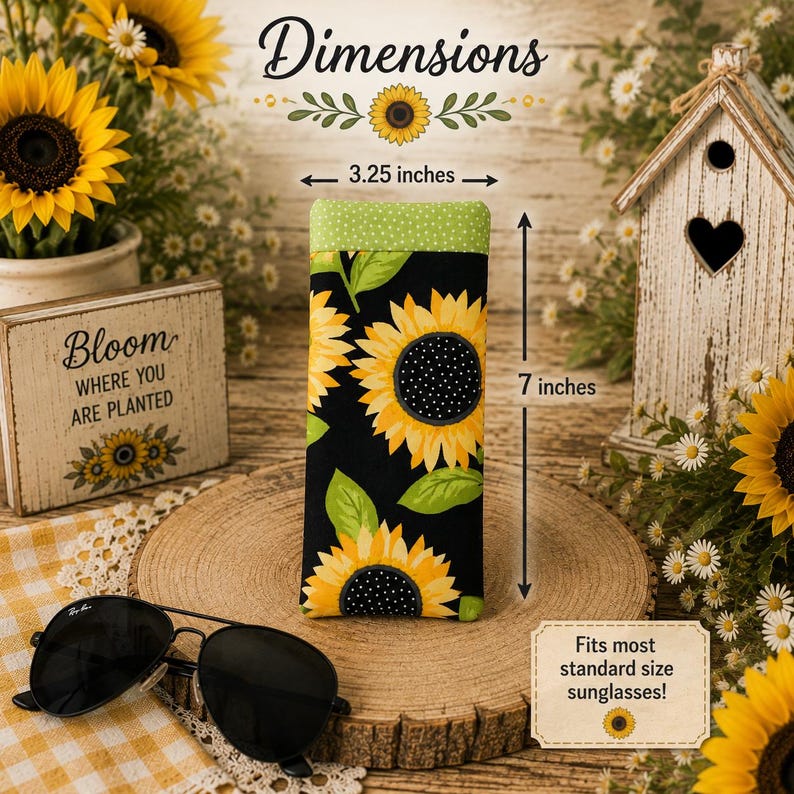 May include: A rectangular fabric glasses case featuring a sunflower pattern on a black background with a green polka dot top border. The case measures 3.25 inches wide by 7 inches tall and is labeled to fit most standard size sunglasses.