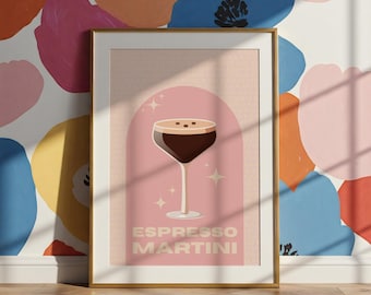 May include: A framed poster with a pink background and a stylized illustration of an espresso martini cocktail. The text "ESPRESSO MARTINI" is printed in a light yellow font.
