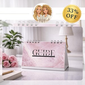 May include: A pink marble-patterned desk calendar with the word "GUIDE" in black. The calendar has a spiral binding and a white base. A gold-colored badge displays "33% OFF". The image also includes a cartoon illustration of two women.