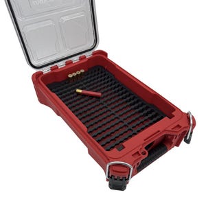 May include: Open red plastic storage case with a clear lid. The interior has black foam inserts and contains several small gold and red objects. The case has a black handle and two black latches.