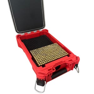 May include: Open red storage case with a black interior and a clear lid. The case contains rows of small, cylindrical, brass-colored objects. The case has a handle and metal loops on the sides.