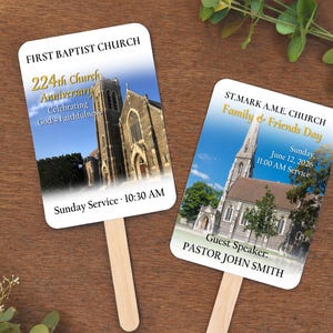 May include: Two church fan favors with wooden handles. One fan reads "First Baptist Church 224th Church Anniversary" with a church image. The other fan reads "St. Mark A.M.E. Church Family & Friends Day" with a church image.