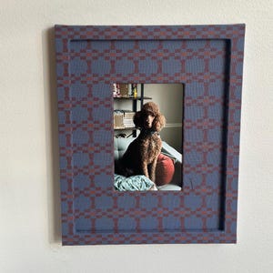 May include: A rustic wooden sign with the text "Welcome to our home" in white lettering. The sign features a distressed finish and a simple, inviting design, perfect for entryway decor.