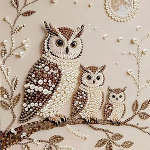 May include: A decorative wall art piece featuring three owls perched on a branch, crafted with white and brown beads and pearls. The design includes a circular moon made of pearls and surrounding branches adorned with pearl accents on a beige background.