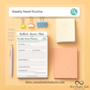 May include: A weekly reset planner with stationery. The planner is open to a page with prompts for priorities, tasks, and self-care. A small notebook with gold accents and a peach-coloured notebook are also present. Paperclips and a pen are visible.