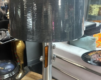 Harley Davidson table lamp made from lower shock arms and breather cover