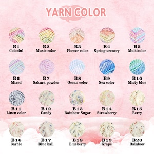 Peut inclure: Un nuancier de pelotes de laine, chacune &eacute;tiquet&eacute;e avec un nom et un code uniques. Les couleurs de fil comprennent une vari&eacute;t&eacute; de teintes, telles que le rose, le bleu, le vert et le jaune. Le texte "YARN COLOR" est en haut.