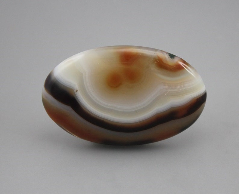Banded agate with moss inclusions cabochon