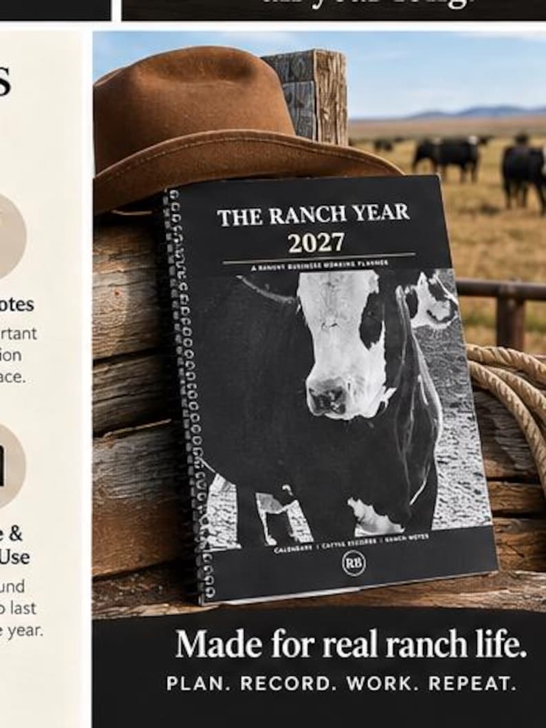 May include: A spiral-bound planner titled The Ranch Year 2027, A Ranch Business Working Planner, featuring a black and white photograph of a cow on the cover, resting against a brown felt hat and stacked wooden logs.