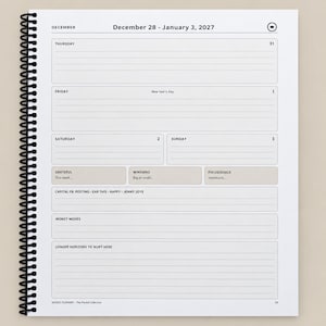 May include: A spiral-bound weekly planner page for December 28 to January 3, 2027. The white page features black text, lined sections for daily entries, and boxes labeled Grateful, Winniens, Focus/Goals, Capital FB, Money Moves, and Longer Horizons.