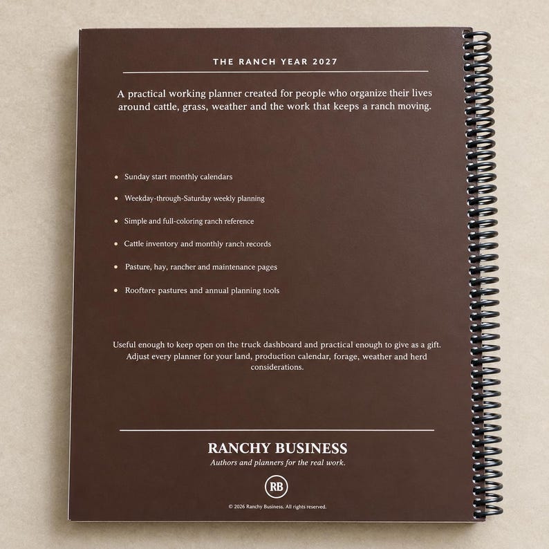 May include: A dark brown spiral-bound planner titled The Ranch Year 2027. The back cover lists features including Sunday start monthly calendars, weekly planning, cattle inventory, and ranch records. The bottom displays Ranchy Business branding.