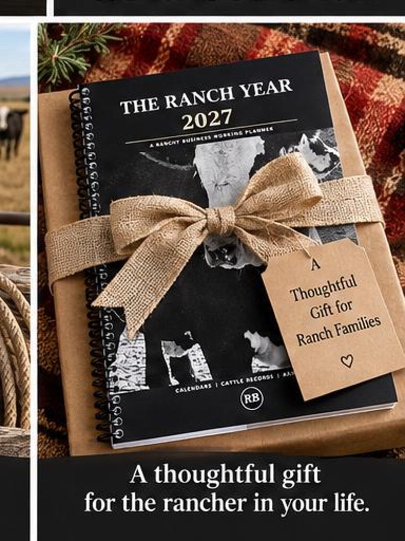 May include: A spiral-bound planner titled The Ranch Year 2027, A Ranch Business Working Planner, featuring a black and white cow graphic. It is wrapped in brown paper with a burlap ribbon and a tan gift tag reading A Thoughtful Gift for Ranch Families.